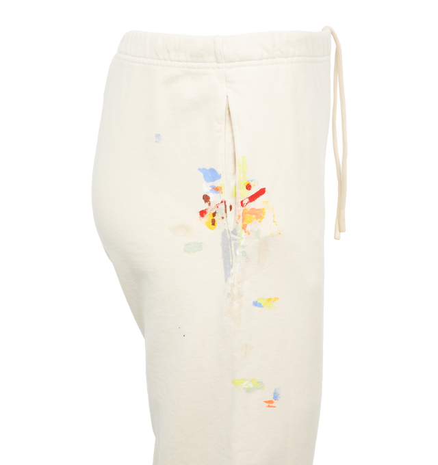 Image 4 of 4 - WHITE - GALLERY DEPT. LOGO SWEATPANTS featuring tapered leg, low-crotch style, elasticated at the waist and hem, paint splatter and logo on leg. 100% cotton. 