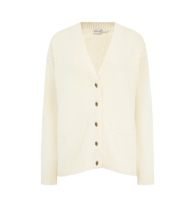 Image 1 of 3 - WHITE - MONCLER Wool & Cashmere V-Neck Cardigan featuring a wool and cashmere blend, stockinette stitch and cable knit, gauge 5, v-neck, snap button closure, front pockets and leather logo patch. 90% virgin wool, 10% cashmere. Made in Italy.
