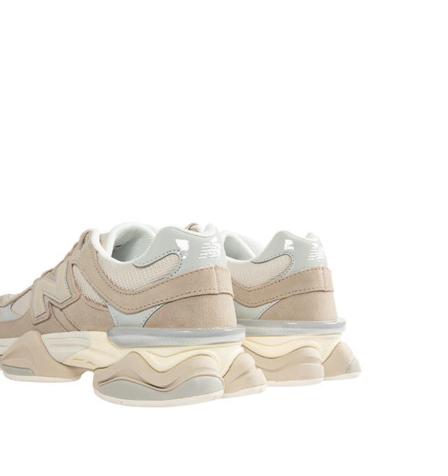 Image 3 of 5 - NEUTRAL - New Balance Unisex 9060 Sneakers feature a mesh upper with pigskin suede overlays and expanded sway bars inspired by the 990. The sculpted dual-density midsole combines ABZORB and SBS cushioning, while a translucent CR device at the heel and a diamond-patterned outsole inspired by the classic 860 complete the design. Upper: Mesh and Pigskin Suede. *Unisex style in men's sizing.