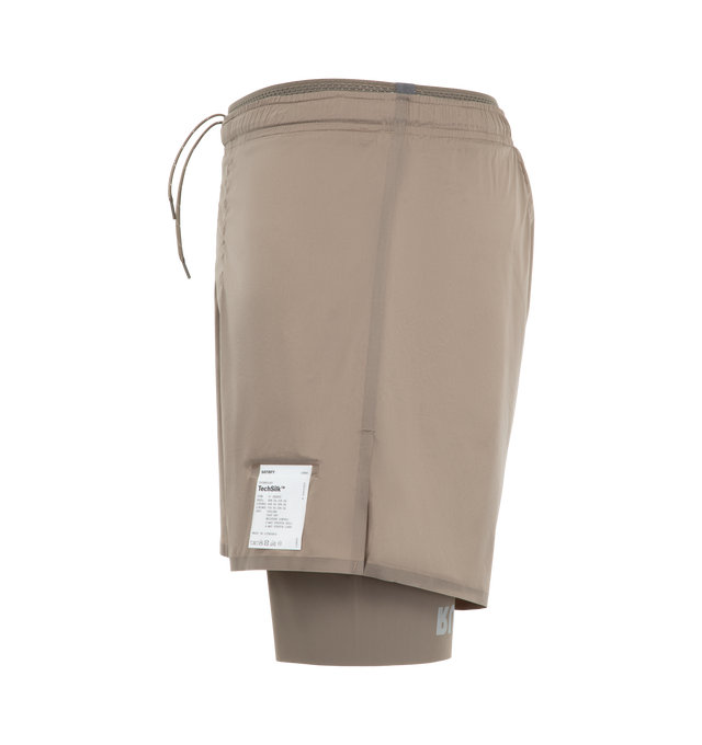 Image 3 of 3 - NEUTRAL - Satisfy Men's TechSilk 8" Shorts are crafted from lightweight French-engineered TechSilk and feature a 5-inch shell paired with an 8-inch Justice TechSilk Evo liner. Designed for long-distance performance, the fast-drying construction is enhanced with Coldblack treatment for cooling, odor control, UV protection, and four-way stretch. Functional details include a sweat-resistant hidden phone pocket, double waistband with internal drawcords, a mini S-Carabiner for keys, and reflectiv