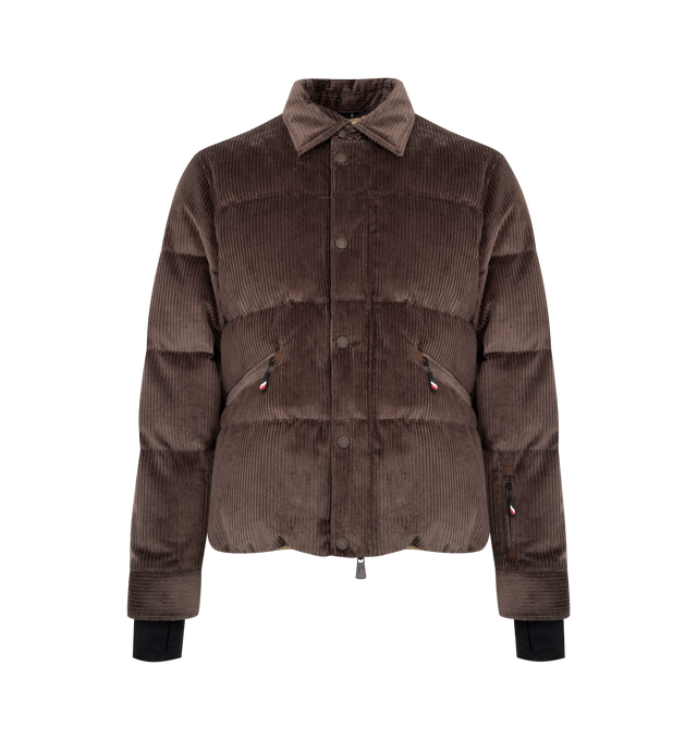 Image 1 of 4 - BROWN - MONCLER GRENOBLE Elgon Corduroy Down Ski Jacket featuring 2L technical corduroy, micro ripstop lining, down-filled, pull-out hood, YKK AquaGuard Highly Water Resistant zipper and snap button closure, pockets with YKK AquaGuard Highly Water Resistant zipper closure, inner media pocket, ski pass pocket, powder skirt, hem with drawstring fastening and synthetic material logo patch. 98% cotton, 2% elastane/spandex. Lining: 100% polyester. Padding: 90% down, 10% feather. Made in Romania.