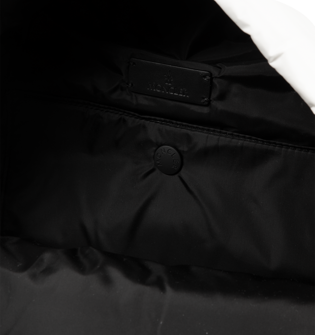 Image 4 of 4 - WHITE - MONCLER Caradoc Water-Repellent Backpack featuring nylon technique lining, calf leather trim, down-filled, detachable hood, adjustable shoulder straps, smooth calf leather handle, zipper closure and zipped pockets. L 30 cm X H 43 cm X D 14 cm. 100% polyamide/nylon. Padding: 90% down, 10% feather.