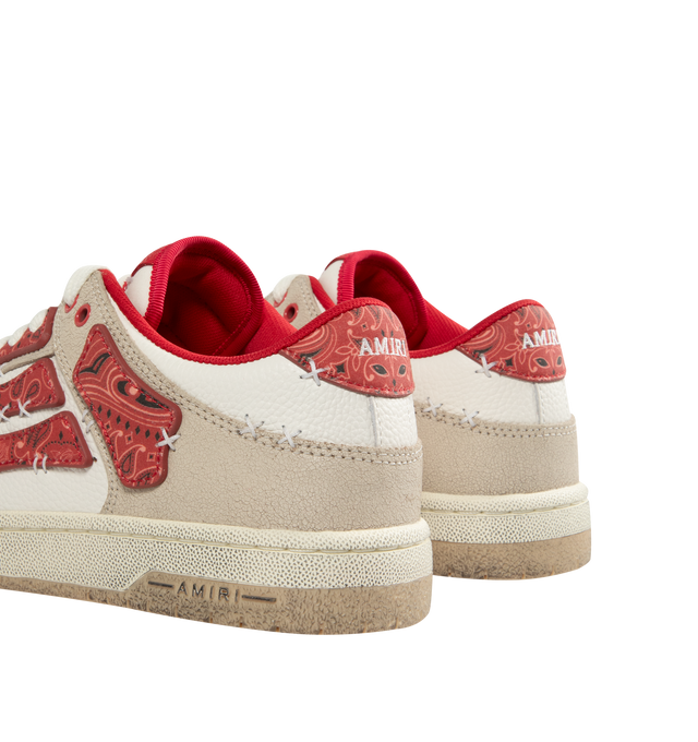 Image 3 of 5 - RED - AMIRI Bandana Skel Top Low Sneakers featuring low-top, buffed leather, logo pattern embossed throughout, perforated detailing at toe, lace-up closure, logo patch at padded tongue, padded collar, bandana print appliqus at sides and treaded rubber sole. Upper: leather. Sole: rubber.