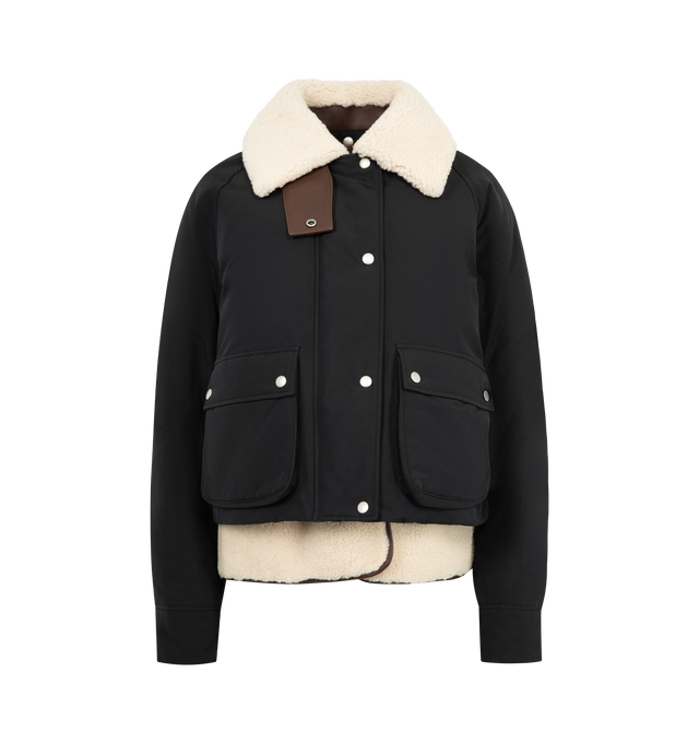 Image 1 of 5 - BLACK - LOEWE Puffer in shearling and cotton blend featuring a detachable shearling vest and collar, regular fit, short length, leather chin strap, snap button and concealed zip front fastening, buttoned gusset flap pockets and LOEWE Anagram embossed leather patch placed at the back. Cotton, polyamide. Made in Italy.