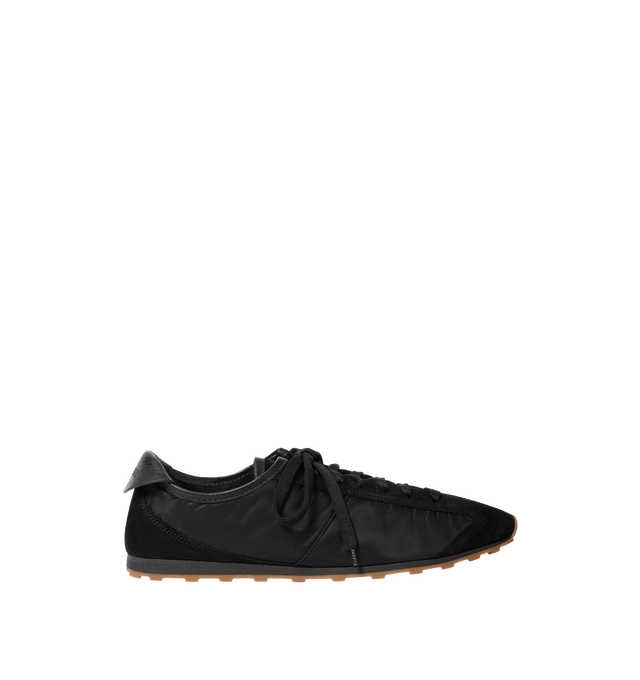 Image 1 of 4 - BLACK - JACQUEMUS Les Tennis Sneaker featuring soft sneaker in hydro-treated suede and nylon, almond-shaped toe, flat laces, embossed logo on the tongue, embossed logo on the heel tab, removable leather-covered insole and rubber outsole in a circle and square shape. 100% polyamide. Outsole: 100% thermoplastic polyurethane. Made in Portugal.