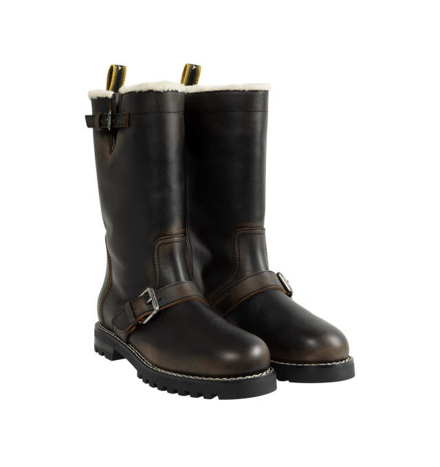 Image 2 of 4 - BROWN - Fendi Women's Commando Boots are crafted from hand-finished antiqued calfskin leather and feature a tubular shaft, adjustable buckle straps at the ankle and calf, and a Fendi Tape pull loop. Designed with clean lines and workwear-inspired hardware, this boot is lined in plush shearling and finished with a lugged rubber sole for traction and durability. Heel Height: 30mm. Main Material: 100% Calfskin. Lining: 100% Lamb Fur Shearling. Sole: Lugged Rubber. Made in Italy.