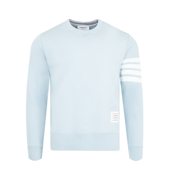 Image 1 of 2 - BLUE - THOM BROWNE Classic Loopback 4-Bar Sweatshirt featuring crew neckline with v patch, engineered 4-bar stripe detail at left sleeve, name tag applique above hem, buttoned side vents with signature striped grosgrain trim and signature striped grosgrain loop tab at back of neck. 100% cotton. Made in Japan.