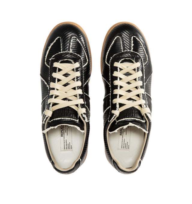 Image 5 of 5 - BLACK - MAISON MARGIELA Replica Sneakers featuring low-top sneakers in cracked leather, panel detailing, lace-up front, textured gum sole and white stitching at the back. Upper: 100% Ovine Leather. Lining: 100% Cotton. Sole: 100% Rubber. Made in Italy.