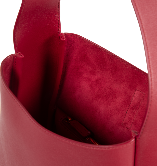 Image 3 of 3 - RED - SAINT LAURENT  Le A 7 soft small shoulder bag has a metal Cassandre hook closure, bronze-tone hardware, and interior zip pocket. Suede lining. 100% calfskin leather. Dimensions: 9 X 8.7 X 3.5 inches.  Made in Italy.