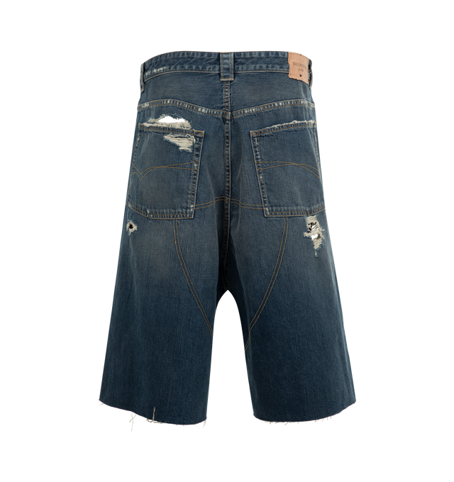 Image 2 of 3 - BLUE - BALENCIAGA Distressed Baggy Shorts featuring cotton denim, extreme destroyed details, mid-waist, covered button fly, 5 belt loops, 5 pockets, visible lining pockets, Balenciaga engraved flex buttons and Balenciaga Jeans jacron at back. 100% cotton. Made in Italy.
