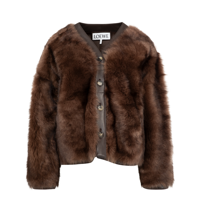 Image 1 of 3 - BROWN - LOEWE Shearling Jacket featuring a fuzzy shearling exterior, leather button placket, side slit pockets. 100% shearling. 100% lamb leather. Filling: 95% polyester, 5% polyamide. Made in Italy.