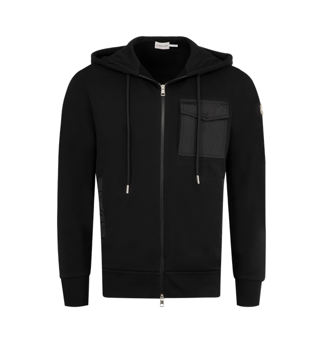 Image 1 of 3 - BLACK - MONCLER Zip Up Hoodie featuring two-way zip fastening, hood with drawstring, ribbed hem and cuffs, nylon chest flap pocket and nylon trim side slit pockets. 87% cotton, 13% polyamide. Trim: 100% polyamide.