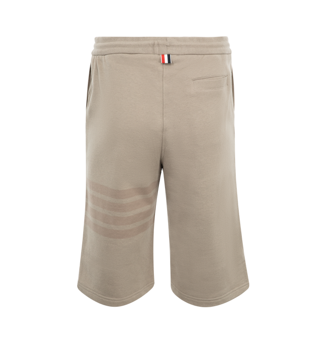 Image 2 of 3 - BROWN - THOM BROWNE Classic Loopback 4-Bar Sweatshorts featuring 4-Bar stripe detailing, drawstring waistband, engineered 4-bar stripe detail at left thigh, name tag applique above left cuff, slip side pockets, single back welt pocket and signature striped grosgrain loop tab at back waist. 100% cotton. Made in Japan.