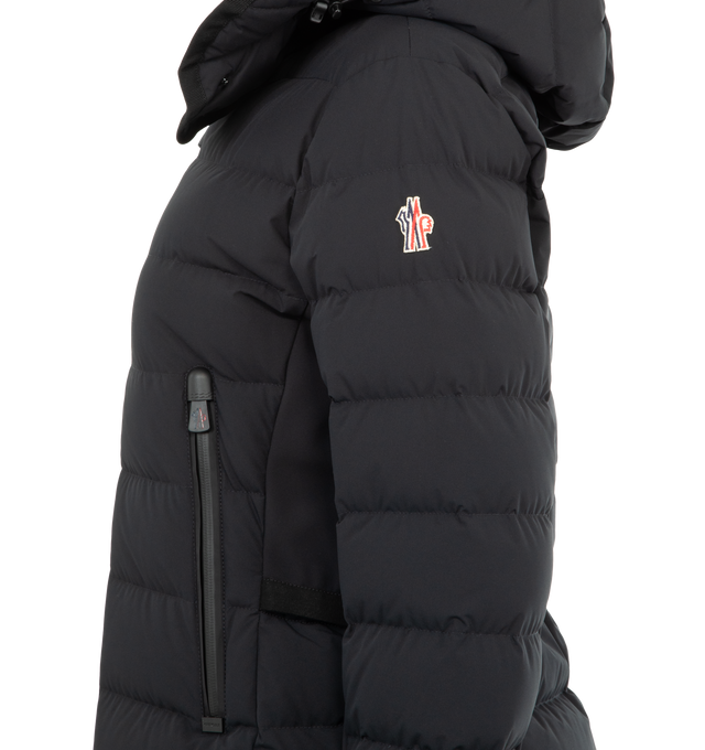 Image 3 of 3 - BLACK - MONCLER GRENOBLE Lamoura Hooded Down Ski Jacket featuring 2L four-way stretch technical poplin, stretch nylon lining, down-filled, adjustable hood with grosgrain trim and polyester lining, 3L four-way stretch technical poplin underarms and sides, YKK AquaGuard highly water-resistant zipper closure, pockets with YKK AquaGuard highly water-resistant zipper closure, inner media pocket with YKK AquaGuard highly water-resistant zipper closure, ski pass pocket with YKK AquaGuard highly wate
