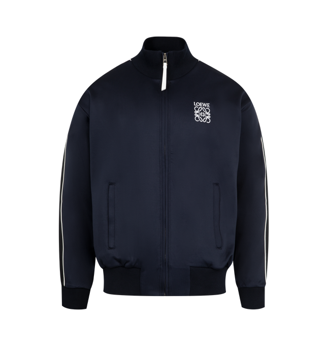 Image 1 of 3 - NAVY - Loewe Men's Tracksuit Jacket in lightweight technical jersey featuring herringbone tape on the sleeves and a mesh lining. Relaxed fit, regular length featuring high neck, rib knit collar, cuffs and hem, zip-front fastening, zipped welt pockets and LOEWE Anagram embroidery placed on the chest. Polyamide/Cotton. Made in Portugal.