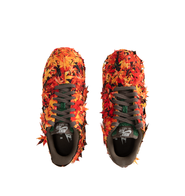 Image 6 of 6 - MULTI - NIKE Air Force 1 '07 Sneaker featuring leaves applied as an outer layer that is intended to be tearaway in certain places over time, slowly uncovering the golden-brown hairy suede base color underneath in the design that suggests fallen leaves on the forest floor being absorbed back into the soil.