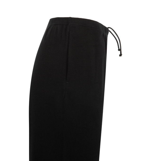 Image 3 of 3 - BLACK - THE ROW Kohana Pant featuring relaxed low-rise sweatpant in ultrasoft Japanese cotton jersey with straight leg, elastic drawstring waist, and side slash pockets. 100% cotton. Made in Italy.