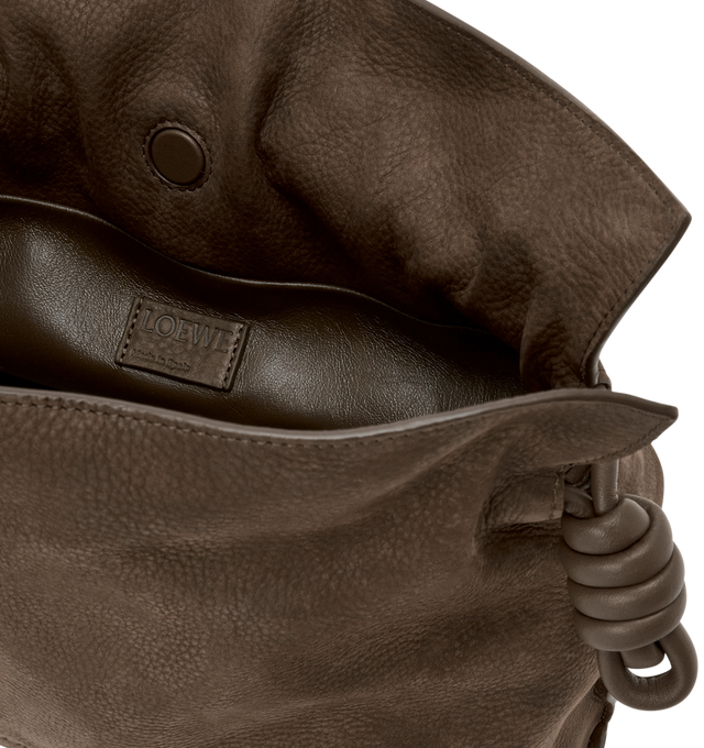Image 4 of 4 - BROWN - Loewe Medium Flamenco Clutch is crafted from grained nubuck and features the brand's signature soft, slouchy silhouette with a cinched closure and iconic knot drawstrings. Designed for shoulder, crossbody, or hand carry with a detachable and adjustable strap, discreet magnetic closure, nappa lambskin lining, and embossed LOEWE logo. Main Material: Grained Nubuck. Lining: Nappa Lambskin. Dimensions: 30 cm W 24.5 cm H 10.5 cm D. Strap Length: 96-120 cm. Strap Drop: 38-44 cm. Weight: 0