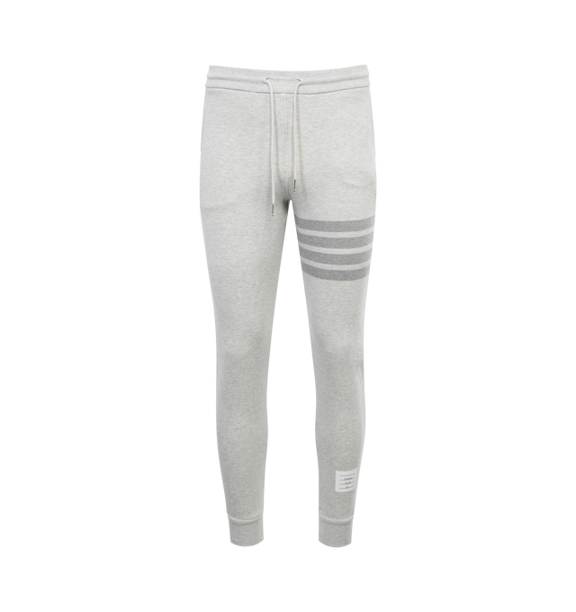 Image 1 of 3 - GREY - THOM BROWNE 4 BAR STRIPE SWEATPANTS featuring drawstring at elasticized waistband, three-pocket styling, 4-bar stripes and logo patch at leg, elasticized cuffs and tricolor grosgrain pull-loop at back waist. 100% cotton. 