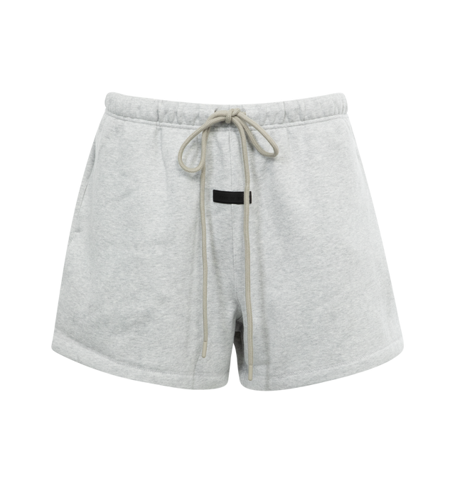 Image 1 of 3 - GREY - FEAR OF GOD ESSENTIALS Running Short featuring cropped length, an encased elastic waistband with elongated drawstrings, side seam pockets and a rubberized label at the center front. 80% cotton, 20% polyester.  