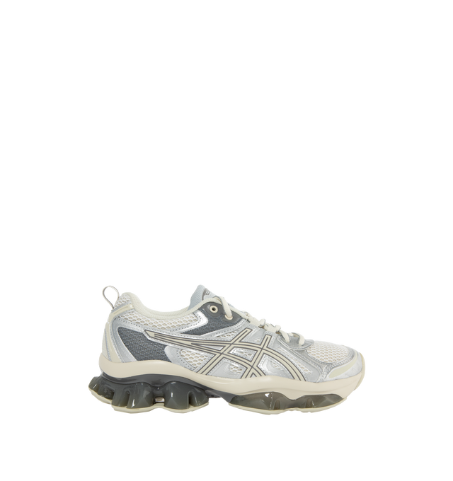 Image 1 of 5 - WHITE - ASICS GEL-QUANTUM KINETIC sneaker combines experimental engineering with functional details for everyday scenarios. Its performance capability is met with technical components to create a modern design thats built for urban exploration. ? Synthetic leathers and various mesh panels are layered throughout the upper to improve comfort. Midsole features Scutoid GEL technology that has a closely packed 3D geometry and an off-axis structure to improve shock absorption in daily scenarios, li