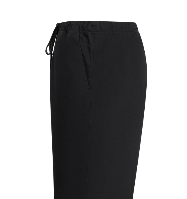 Image 3 of 3 - BLACK - FEAR OF GOD ESSENTIALS Twill Work Pant crafted from cotton/polyester featuring a loose leg fit, side pockets, an encased elastic waistband with drawstrings, knee darts, and snap metal hardware at the ankle. A rubberized label from Fear of God Essentials is stitched on the center front. 55% cotton, 45% polyester twill.