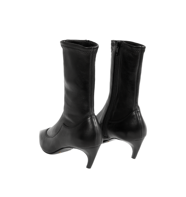 Image 3 of 4 - BLACK - Khaite Women's Valerie Mid-Calf Boots are crafted from black stretch nappa lambskin selected for its soft patina and flexibility. The close-fitting silhouette features an elongated pointed toe, sculpted lines, a curved heel integrated into the leather sole, and a side zipper closure. Upper: 100% Lambskin. Sole: 100% Calfskin. Heel Height: 5.5 cm / 2.2 in. Made in Italy.