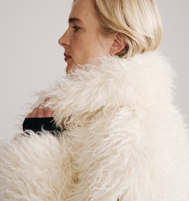 Image 3 of 4 - CREAM - Moncler Grenoble Women's Malencos Padded Short Jacket is crafted from plush faux fur and features a sophisticated peacoat-inspired silhouette with oversized lapels and lightweight padding for warmth. Inspired by the brand's mountaineering heritage, this textured outerwear style blends elevated alpine design with everyday comfort. Finished with a snap-button front closure, side pockets, an interior media pocket with a YKK AquaGuard NATULON water-repellent zipper, and stretch jersey wri