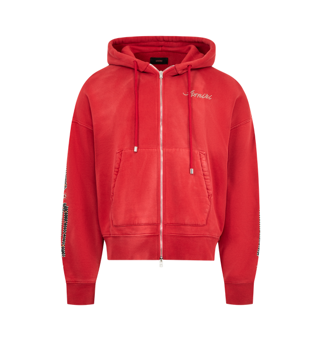 Image 1 of 3 - RED - AMIRI Bones Studded Zip Hoodie featuring oversized fit, zip front closure, bones appliques with stud detailing and front patch pockets. 100% cotton.