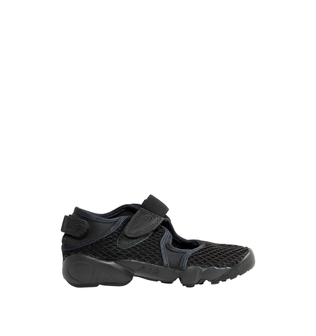 Image 1 of 5 - BLACK - Nike Women's Air Rift Sneaker featuring hook-and-loop straps on the midfoot and heel, Nike Air unit in the heel combined with plush foam, rubber detailing on the outsole, upper features a blend of elastane, polyester and nylon materials for a flexible fit and split toe design.