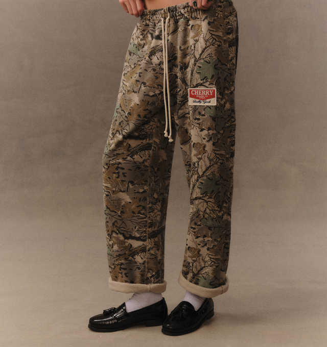 Image 5 of 6 - GREEN - Cherry LA Chevron Parachute Sweatpants are crafted from custom cotton fleece and feature a wide-leg silhouette with a relaxed, laid-back fit. Designed with a patch detail at the leg, an adjustable drawcord waistband, and a branded label at the back pocket, these everyday sweatpants blend comfort-focused construction with Cherry LA's signature contemporary aesthetic. Main Material: Custom Cotton Fleece. Made in Los Angeles, USA.