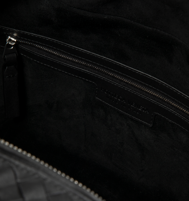 Image 3 of 3 - BLACK - Bottega Veneta Men's Bauletto Bag is crafted from Intrecciato leather and features an adjustable and detachable crossbody strap, a zip-top closure, and a suede-lined interior. Designed for everyday organization, it includes one interior zip pocket and two flat open pockets, and is finished with silver-tone hardware. Main Material: Calfskin Leather. Lining: Suede. Hardware: Silver Finish. Made in Italy. *This item may be restricted for online purchase to international clients. For assi
