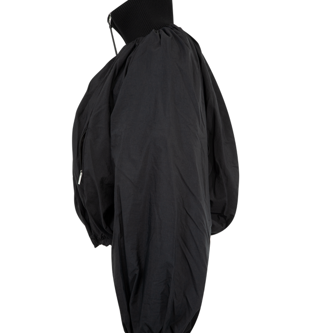 Image 3 of 3 - BLACK - JACQUEMUS Pallone Bomber Jacket featuring parachute bomber with a rounded fit, matte lightweight nylon, draped outer shell, ribbed funnel collar, cuffs and hem, zipped closure with long leather puller, zipped pockets, wadded interior and fully lined. 96% polyamide, 4% polyurethane. Lining: 55% cotton, 45% polyester. Made in Tunisia.