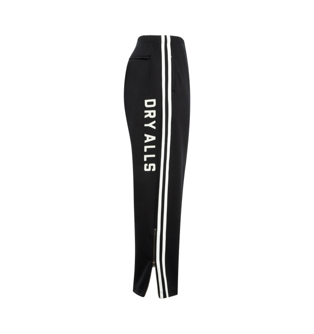 Image 3 of 4 - BLACK - HUMAN MADE Track Pants featuring straight cut with sharp front pleats, stripes down side seams, elasticated waist, two front pockets, one back pocket, vented hem and text graphic on leg. 100% polyester.