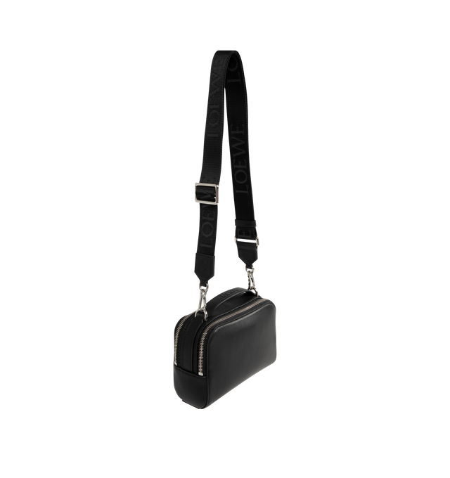 Image 2 of 3 - BLACK - LOEWE Mini Crossbody Camera Bag in satin calfskin featuring two zipped compartments, crossbody or hand carry, adjustable and detachable LOEWE webbing strap, herringbone cotton canvas lining and debossed LOEWE Anagram patch. Satin calf. 13 cm x 18 cm x 8.5 cm. Made in Portugal.