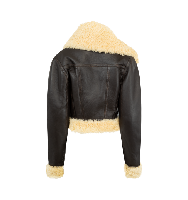 Image 2 of 3 - BROWN - JACQUEMUS Asymmetric Aviator Jacket featuring straight fit, double-sided lambskin leather shearling, asymmetric fur collar with adjustable strap, slanted zipper closure, large welt pockets, shearling fur-trimmed cuffs and hem and back yoke. 100% lamb leather. Made in Turkey.