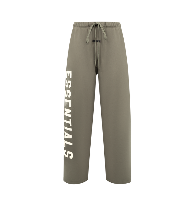 Image 1 of 4 - GREEN - FEAR OF GOD ESSENTIALS Lounge Fleece Sweatpant featuring lounge fit, oversized, voluminous leg and seat, "Essentials" screenprint logo, encased elastic waistband, heavyweight drawstring with rubberized tip, side seam pockets and "Fear of God Essentials" translucent rubberized label. 80% cotton, 20% polyester fleece.