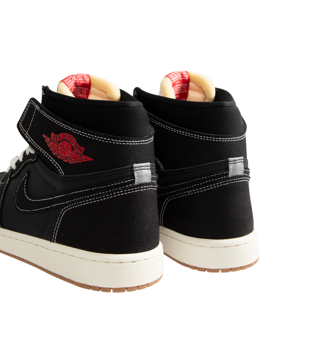 Image 3 of 5 - BLACK - Men's Air Jordan 1 Retro High OG Flight Club Sneakers feature a genuine leather and suede upper with the iconic high-top silhouette, signature Wings branding, and a stitched Swoosh for a timeless heritage look. These lifestyle sneakers combine encapsulated Air-Sole cushioning with a durable rubber outsole for lightweight comfort, lasting support, and reliable traction. Main Material: Genuine Leather and Suede. Midsole: Encapsulated Air-Sole Unit. Sole: Rubber.