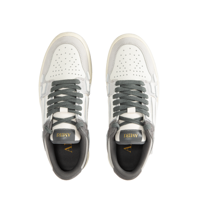 Image 5 of 5 - GREY - AMIRI Distressed Skel-Top Low Sneakers featuring appliqus throughout, perforated detailing at toe, lace-up closure, logo patch at padded tongue, padded collar, logo embossed at heel tab and treaded rubber sole. Upper: synthetic, leather. Sole: rubber.
