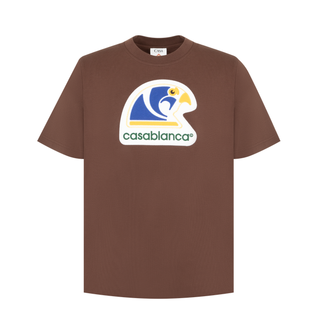 Image 1 of 2 - BROWN - CASABLANCA Applique Classic T-Shirt featuring short sleeves, crew neck, relaxed fit and graphic on front. 100% cotton.