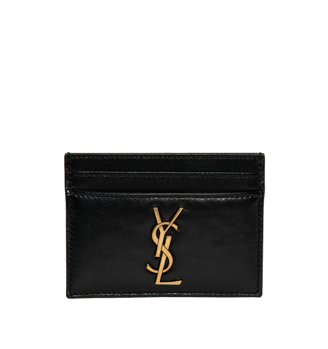 Image 1 of 3 - BLACK - SAINT LAURENT Card Holder featuring leather exterior and interior, gold-tone cassandre hardware at front, 4 card slots and center compartment. 4" W x 3" H. 