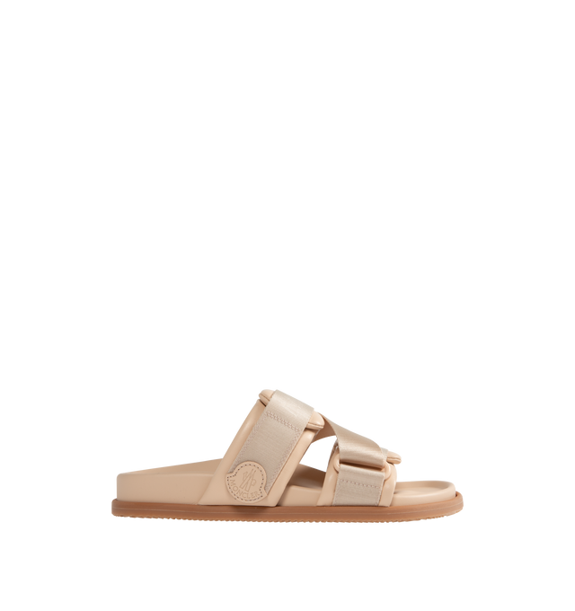 Image 1 of 4 - NEUTRAL - MONCLER Mon Summer Leather Crisscross Sandals featuring crisscross logo-stamped polyester strap, flat heel, dual band upper, slip-on style, molded footbed, rubber outsole. Lining: leather. Made in Italy.