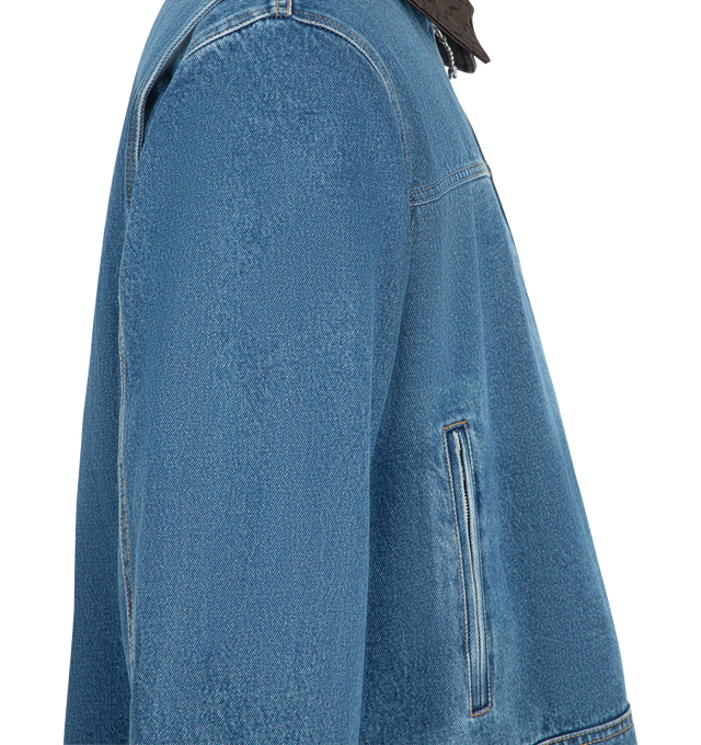 Image 3 of 3 - BLUE - Bottega Veneta Men's Denim Jacket is crafted from washed denim panels and features a boxy silhouette with an Intrecciato leather collar. Designed with a workwear-inspired construction, it is finished with a zip-front fastening, zipped pockets, and metallic knot pull-tabs that add a sculptural touch. Main Material: 100% Cotton. Collar: 100% Leather. Made in Italy.