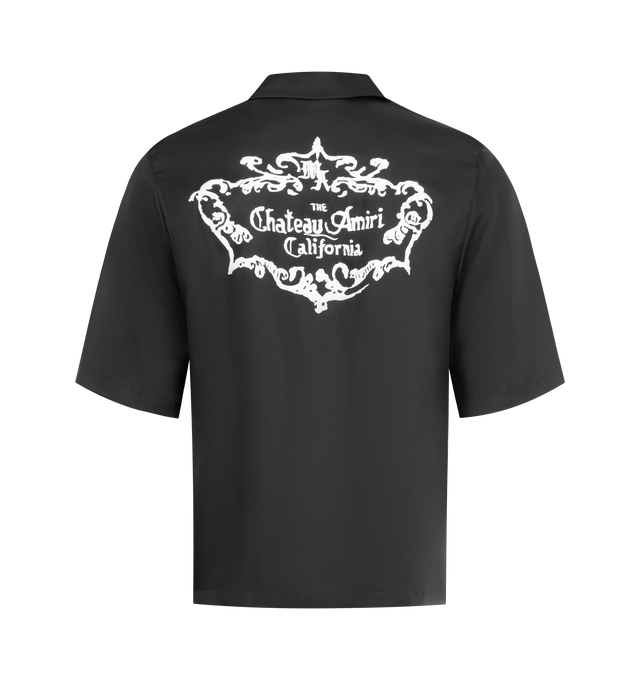 Image 2 of 2 - BLACK - AMIRI Chateau Crest Silk Camp Shirt featuring a boxy fit, filigreed crest seen throughout the 'Chateau Amiri' collection, front button closure, convertible collar, short sleeves and chest patch pocket. 100% silk. Made in Italy.
