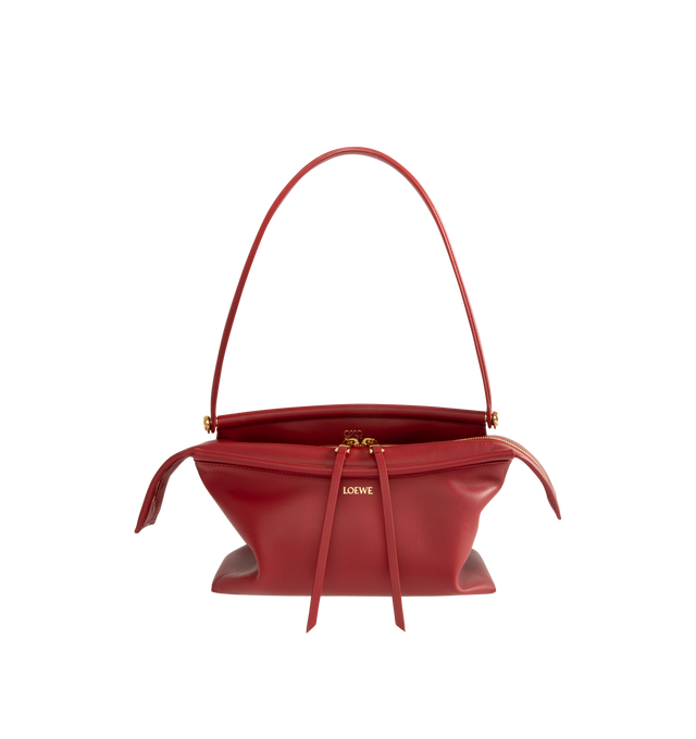 Image 1 of 3 - RED - Loewe Small Whisker Bag is crafted from black glazed calfskin and features a slouchy silhouette with a structured handle and oversized zip opening. Designed for shoulder, crossbody, or hand carry, it includes a detachable strap with rotating dog clips, articulated zipper pulls, foldable D-rings, an exterior flat pocket, and an interior flat pocket. Gold-tone hardware and embossed Loewe and Double L branding complete the design. Fits a large phone, small wallet, sunglasses, and keys. Mai