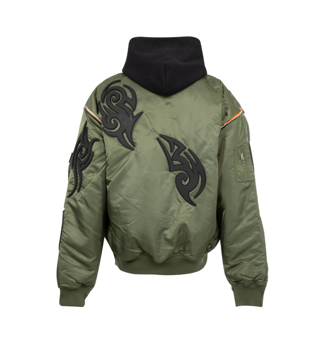 Image 2 of 3 - GREEN - VETEMENTS Tribal Reworked Bomber jacket featuring front zip closure, drawstring hood, ribbed cuffs and hem, front pockets with flap and patch designs throughout.