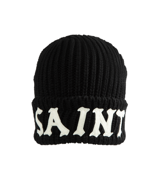 Image 1 of 2 - BLACK - SAINT Mxxxxxx Knit Cap / Saint Beanie is crafted from a wool and acrylic blend and features a rib-knit construction with a rounded crown silhouette. Designed for everyday cold-weather wear, this essential accessory is finished with a logo graphic print that reflects the brand's signature aesthetic. Main Material: 50% Wool, 50% Acrylic.