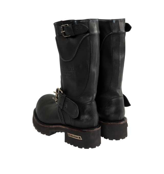 Image 3 of 4 - BLACK - BALENCIAGA Venom Boot featuring extra round toe, 20 mm arch, worn-out effect, adjustable straps with belt buckles, Balenciaga and 10 AV George V 75008 Paris logo debossed on the upper, plate with Balenciaga logo engraved on exterior outsole and thick toothed rubber outsole. Calfskin. Sole: micro, TPU, calfskin, zamac. Made in Italy.