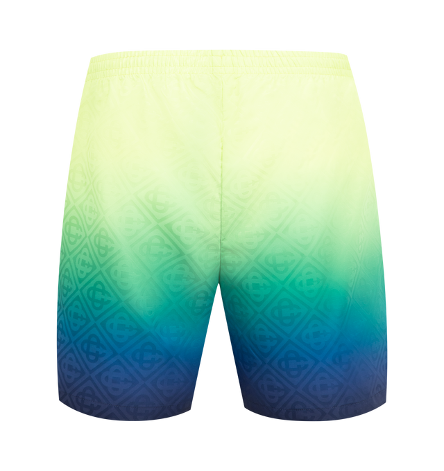 Image 2 of 3 - MULTI - CASABLANCA Gradient Monogram Swim Shorts featuring gradient detailing, an elasticised waistband, drawstring fastening, in-seam side pockets and the house's signature monogram pattern. Technical swim fabric. 100% polyester. Lining: 80% polyester 20% elastane. Made in Portugal.