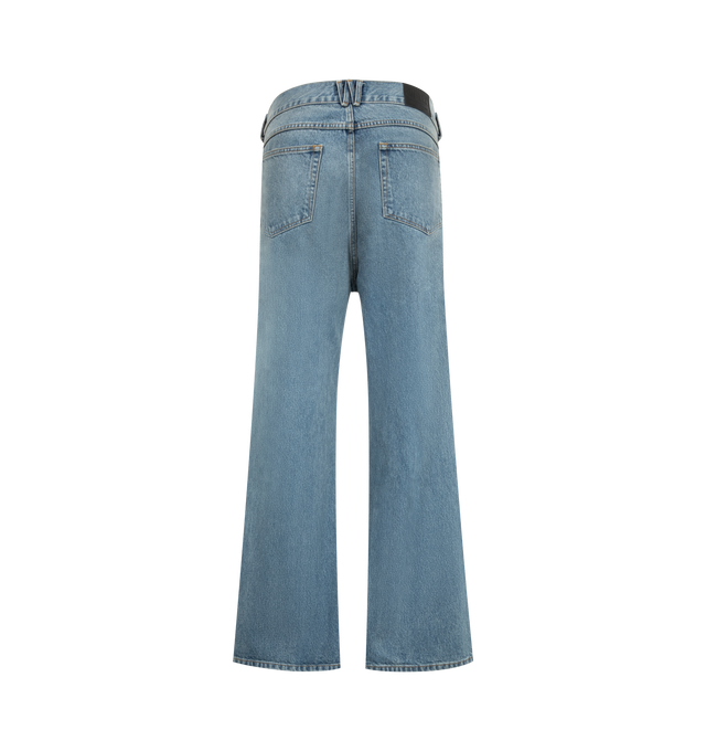 Image 2 of 3 - BLUE - Willy Chavarria Men's Flared Denim Jean is crafted from washed cotton denim and features a relaxed fit through the hip and thigh with a wide, slightly flared leg that creates an elongated silhouette. Designed with an intentional dirty finish, this designer jean is detailed with a branded gold-tone button closure, key loop, signature W belt loop at the back, and a branded leather patch. Main Material: 100% Cotton. Made in USA.